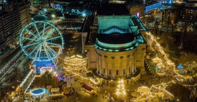 an aerial shot of St George\'s Hall with Christmas markets