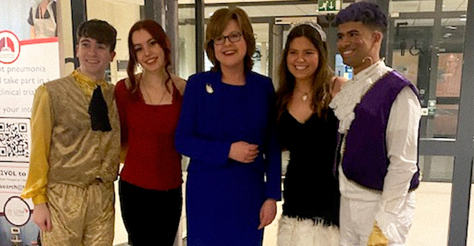Beauty and the Beast cast pose with the Dean