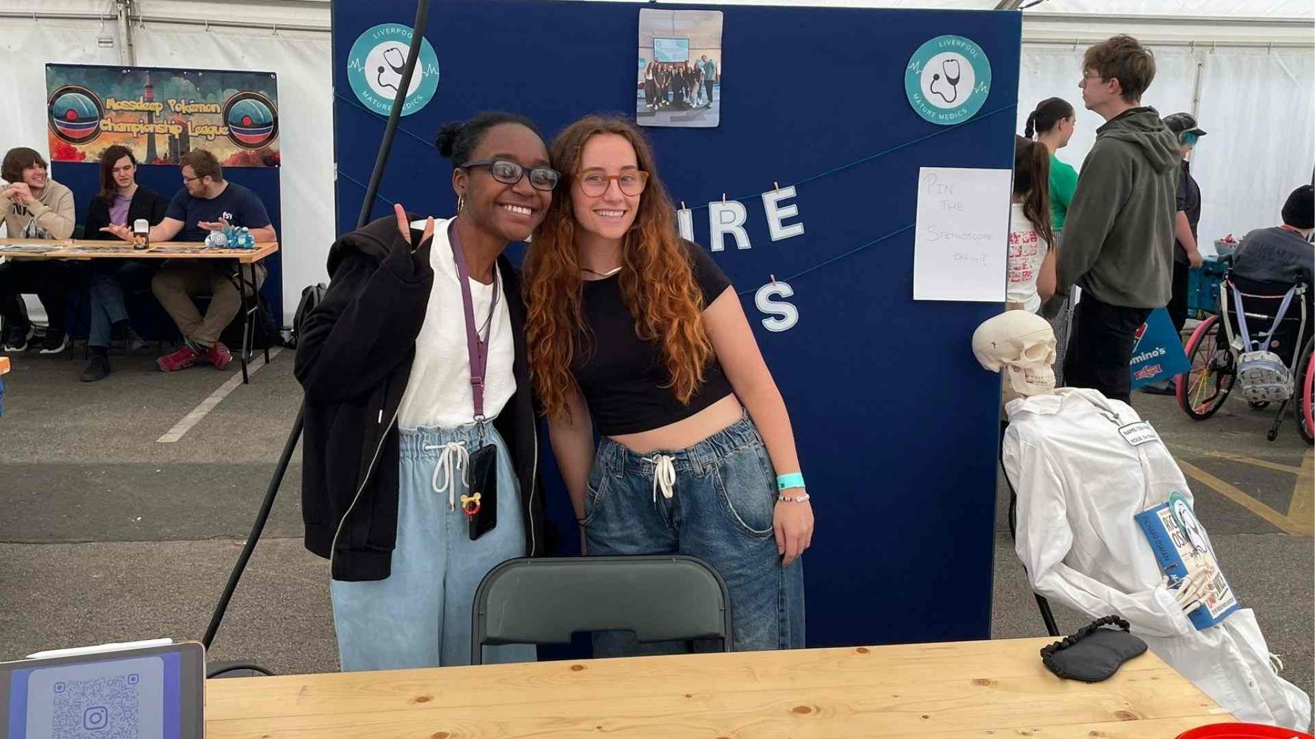 Mature Medics at the society stall during the Welcome Fair – complete with leaflets, smiles, and a skeleton in a lab coat.