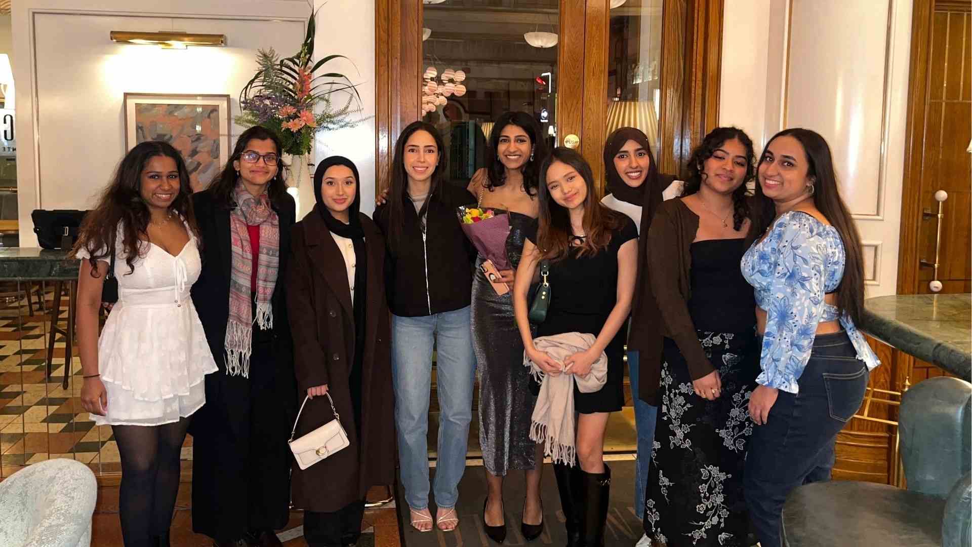 A group of ten students celebrating a special occasion.