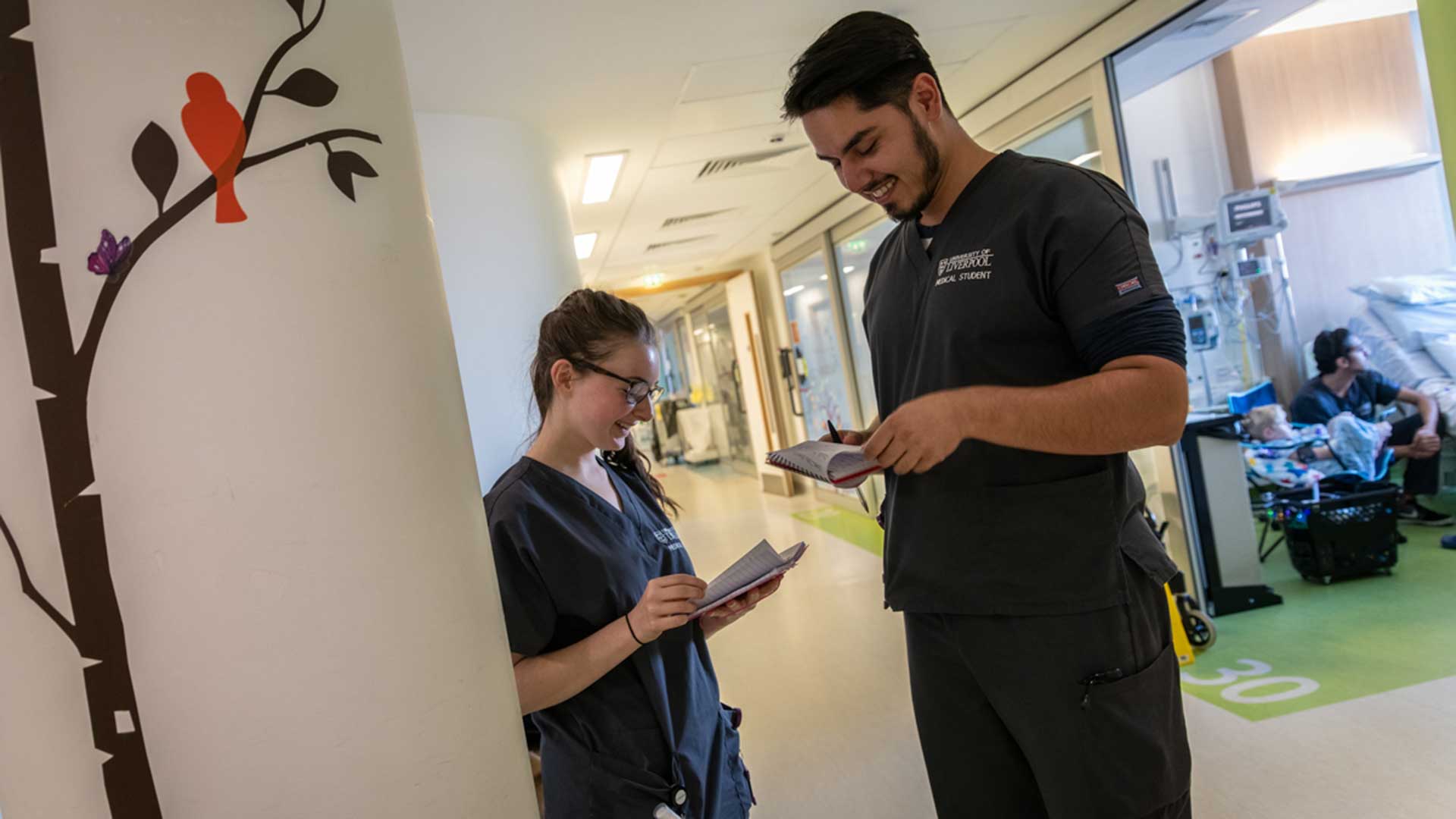 student doctors in scrubs on placement at Alder Hey children's hospital
