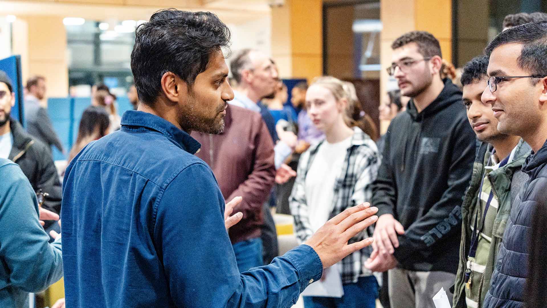 students and clinicians speak at careers fair