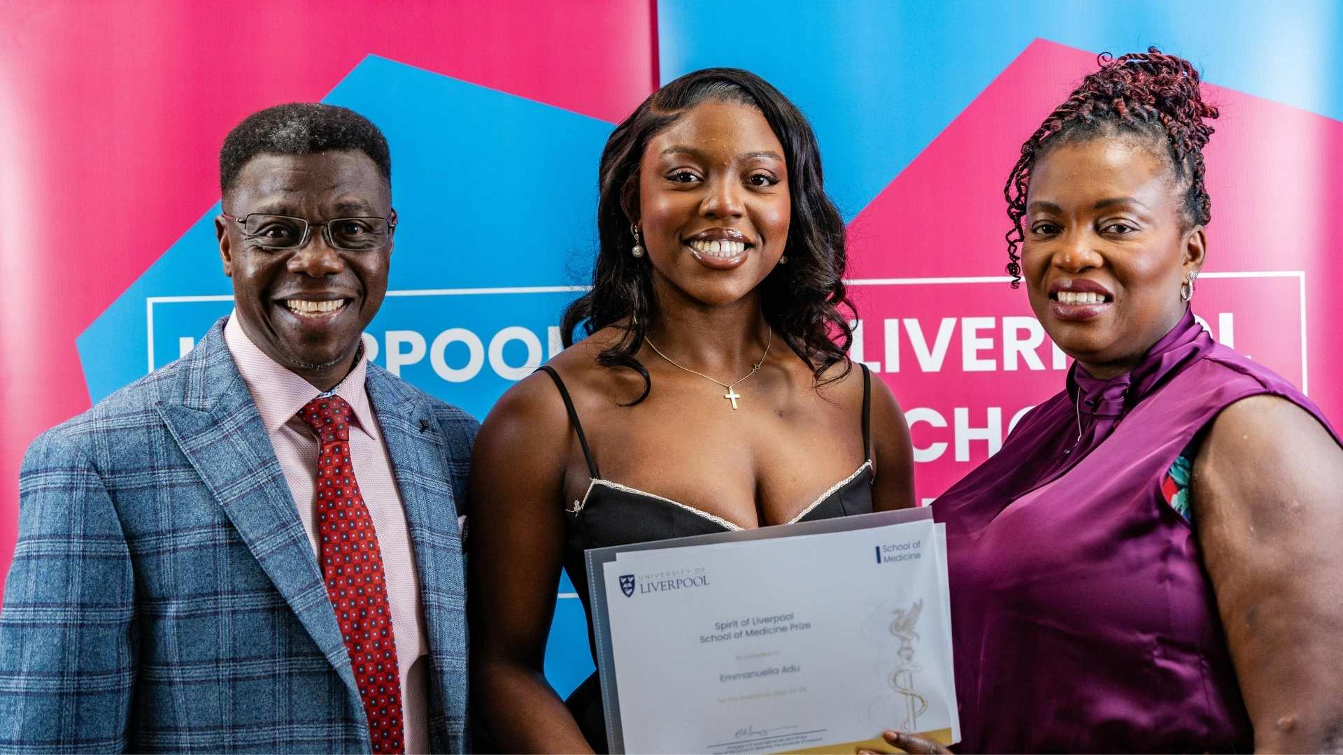 Spirit of Liverpool prize winner, Emmanuella Adu standing with her parents and holding her certificate