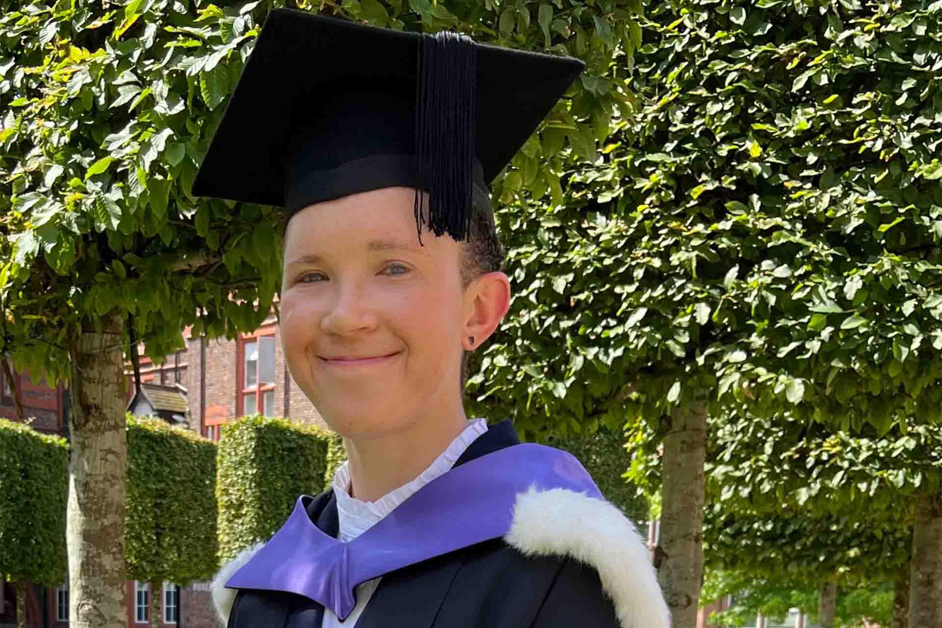 graduate in cap and gown
