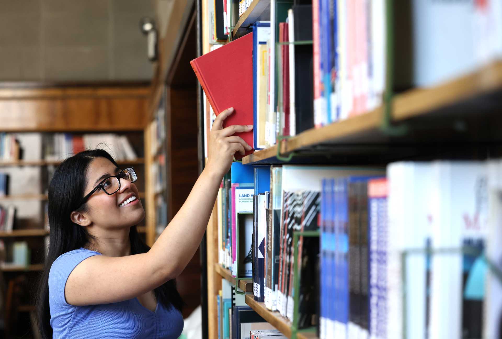 PGR student in the library