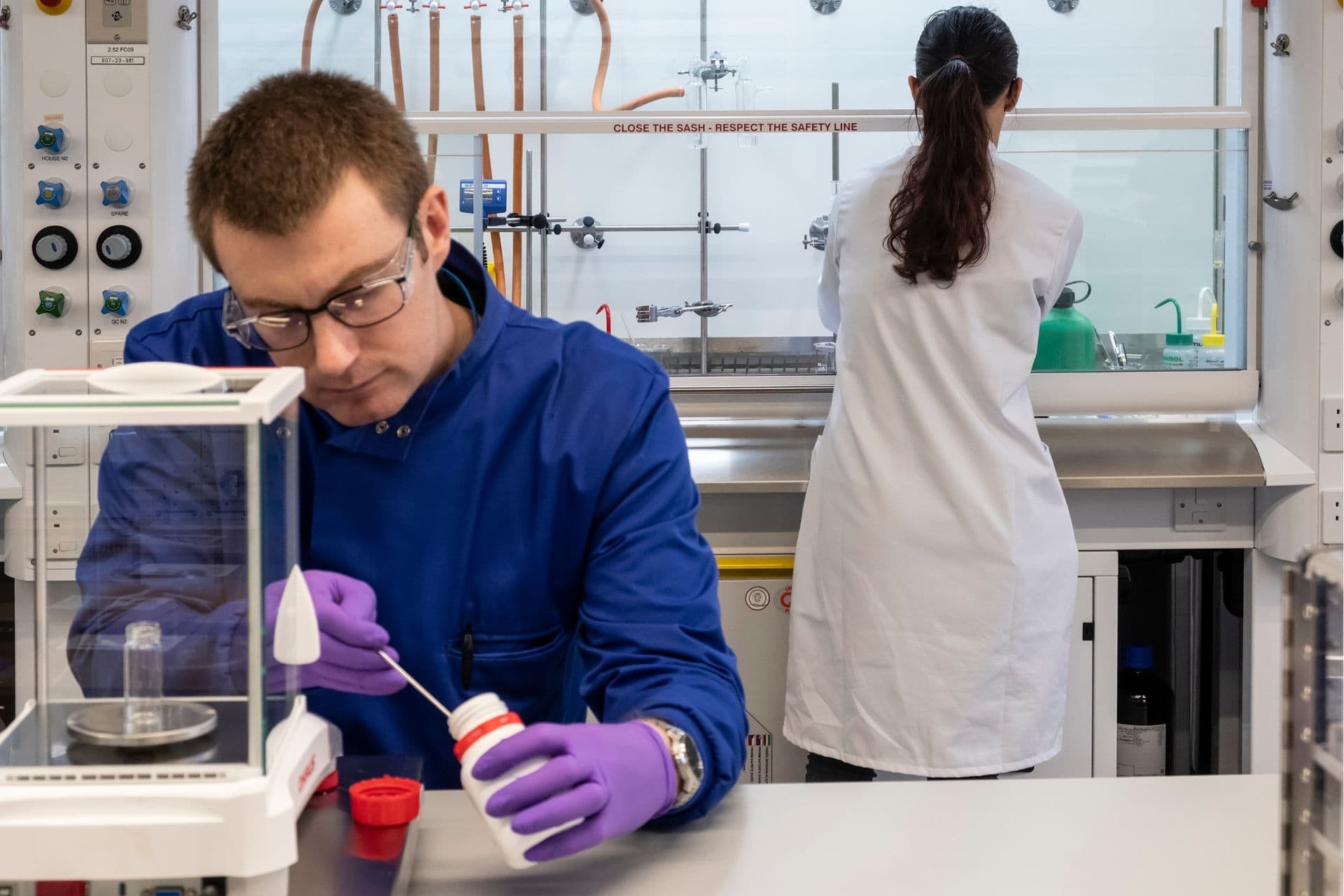 Two researchers working in a lab