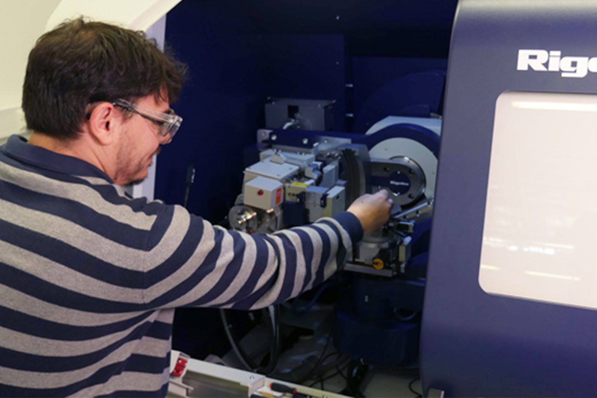 A student using the X Ray diffraction machine