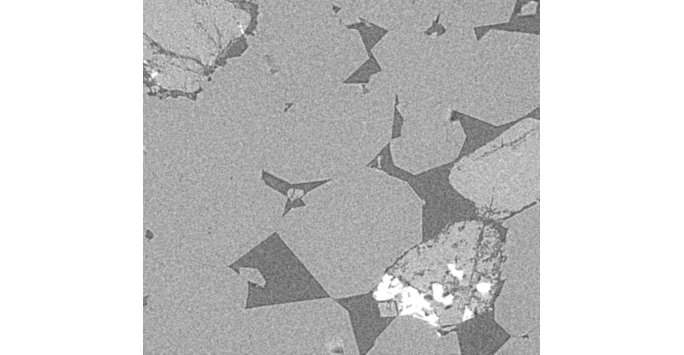 X-ray CT slice of a sandstone, showing quartz grains and pores.