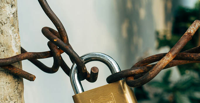 Lock on a rusty chain