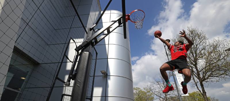 student playing basketball