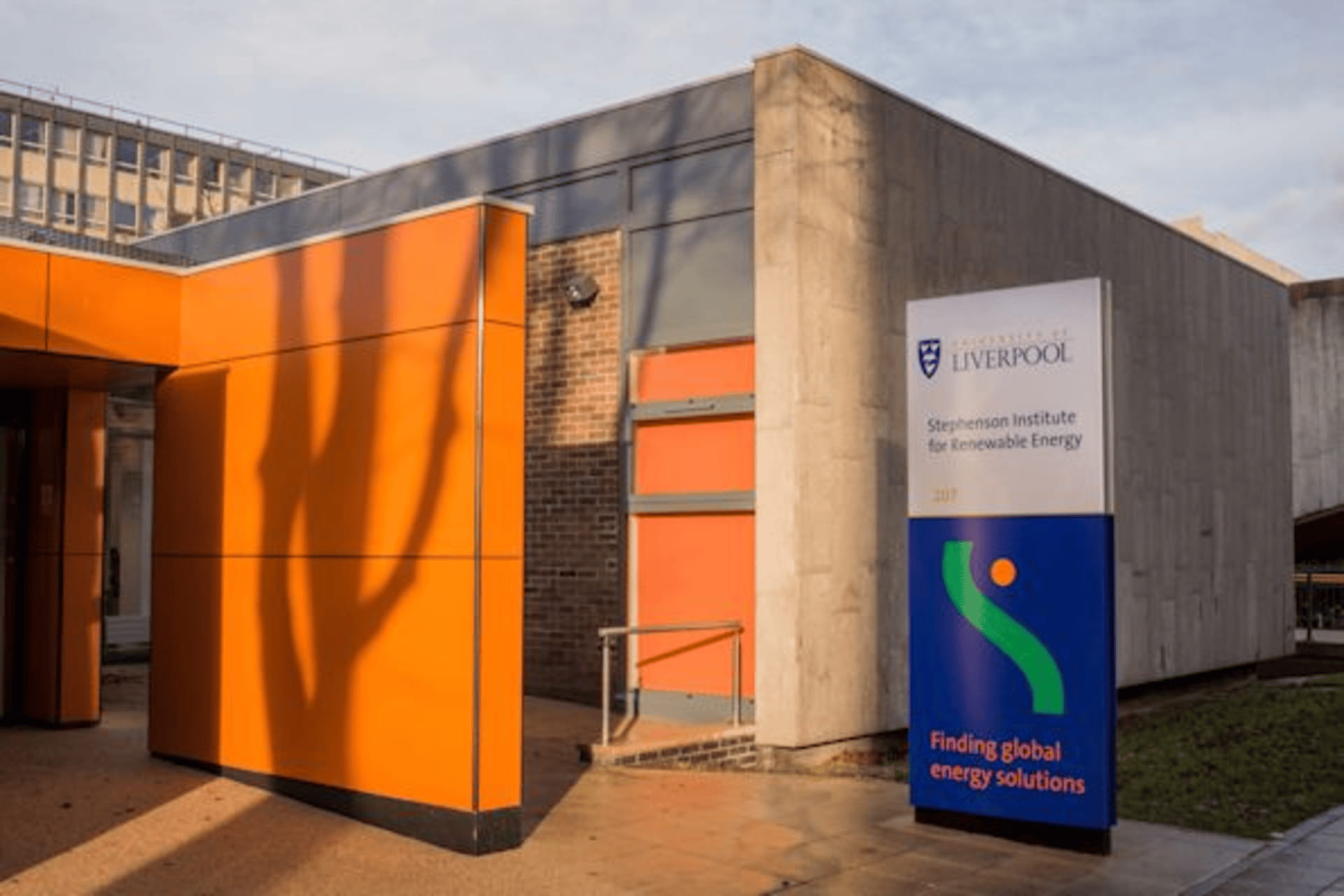 image outside sire building enterance showing its sign and building background