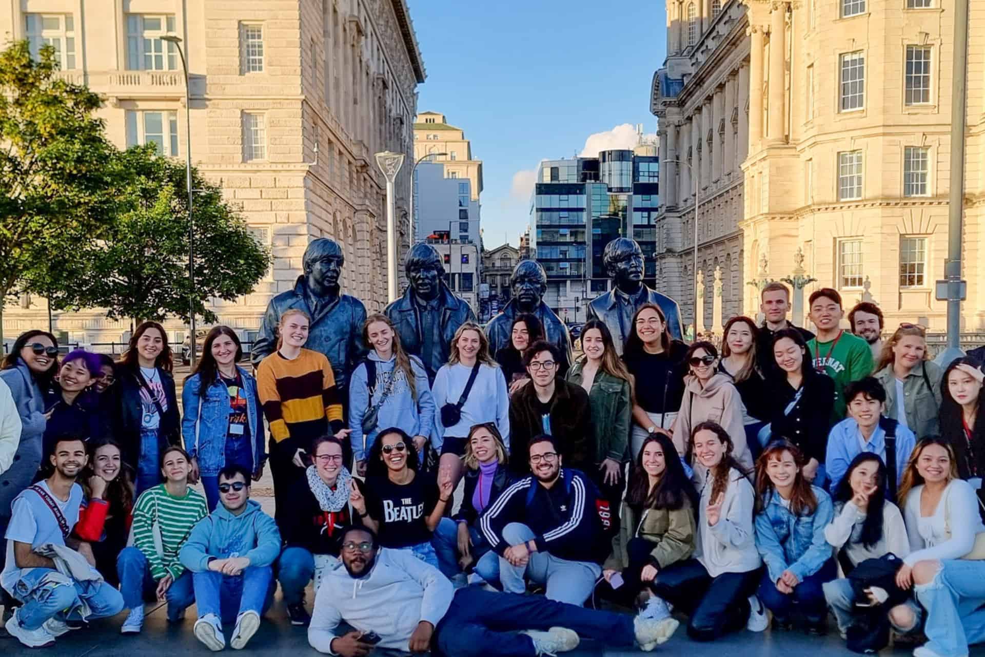 A group of ISS students infront of The Beatles Statue, Liverpool