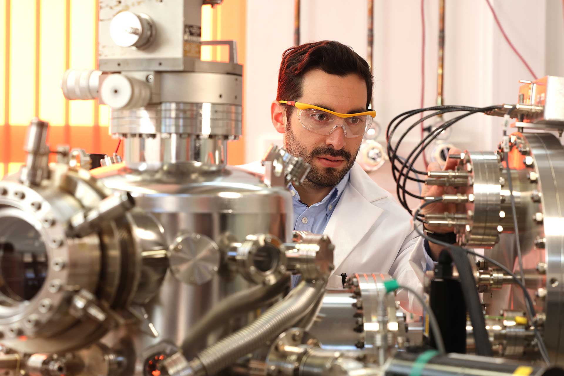A postgraduate researcher working in a laboratory.