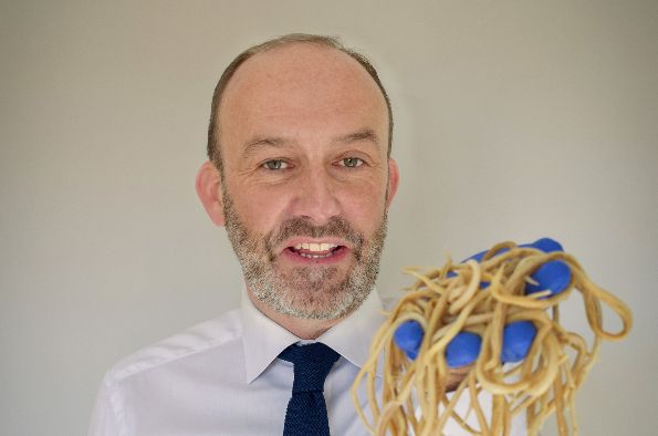 Professor Mark Viney holding worms