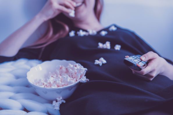 woman eating popcorn